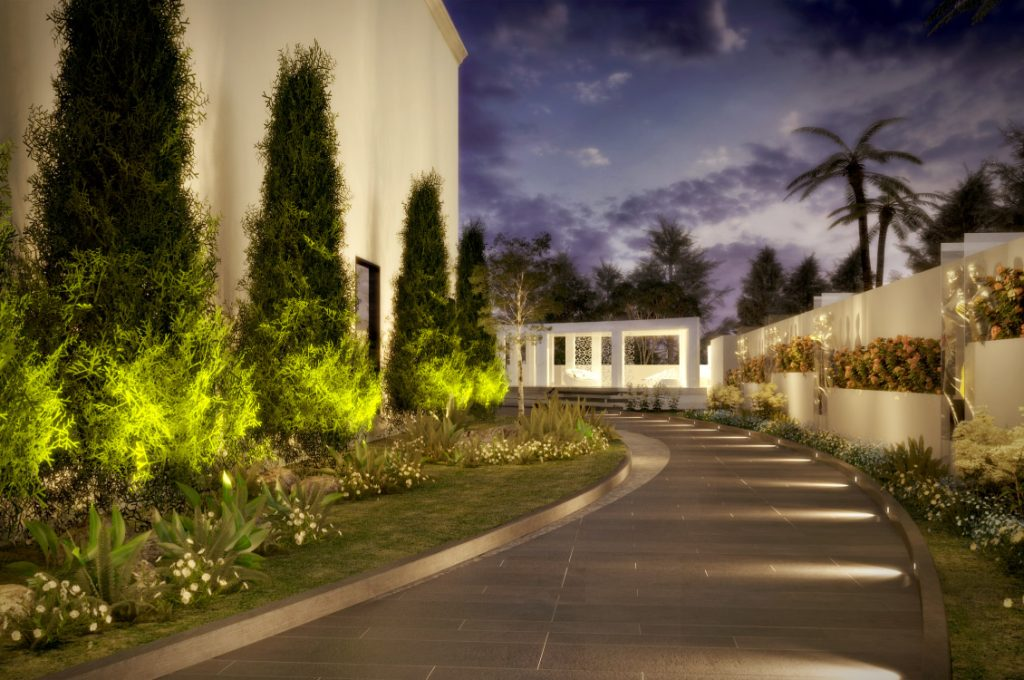 Dubai villa garden at dusk with warm outdoor lighting